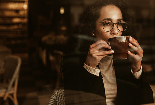 Woman having coffee at a cafe