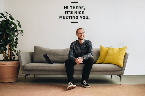 Freelancer looking relaxed in lobby