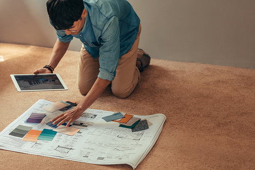 Designer selecting color scheme for new house project