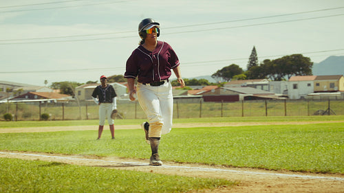 Baseball player slides into base