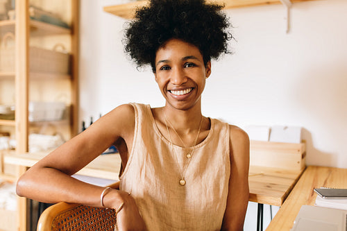 Happy jewelry designer in workshop