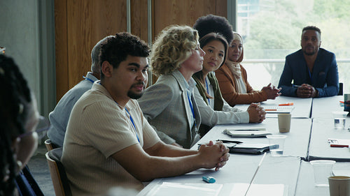 Diverse business team collaborating in meeting.