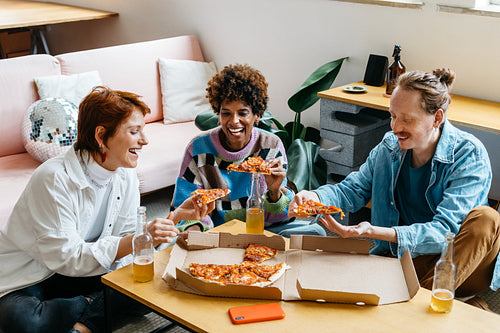 Colleagues sharing a meal in a vibrant co-working space