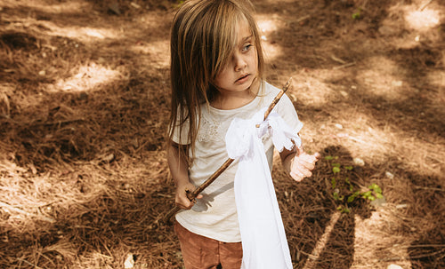 Child playing in forest