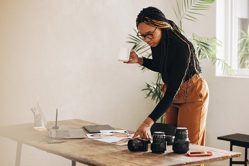 Young photographer working with photographs