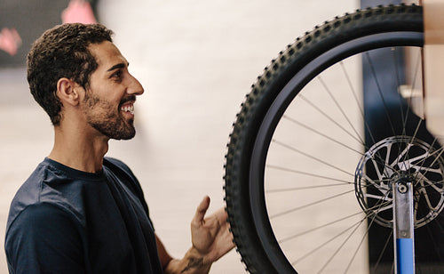 Mechanic repairing a bicycle in workshop