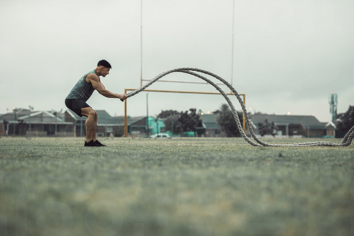 Athlete working out with battle ropes outdoors – Jacob Lund Photography ...
