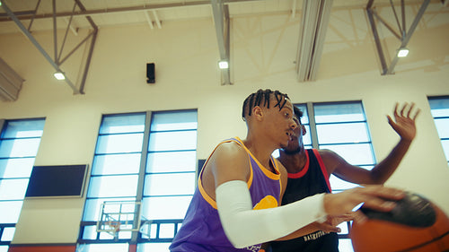Young men training basketball together