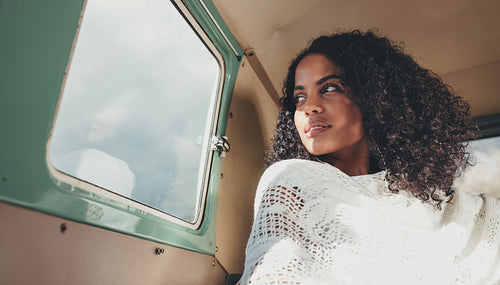Woman on road trip traveling in a van
