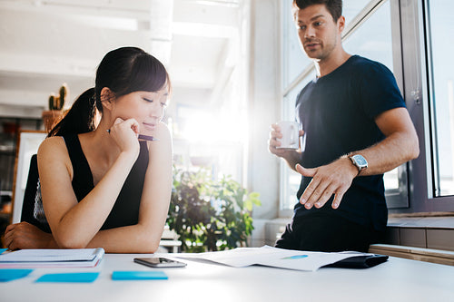 Executives discussing new business ideas in office