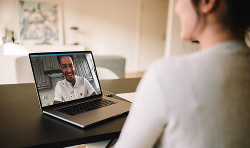 Couple having video call on laptop
