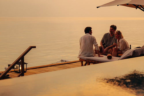 Serene family moment: Togetherness and relaxation during a beautiful sunset