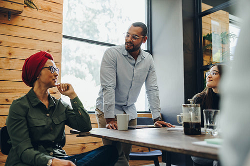 Ethnic businesspeople having a meeting in a creative office