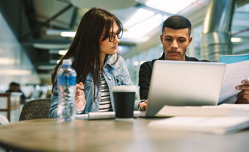 Students studying together at university campus