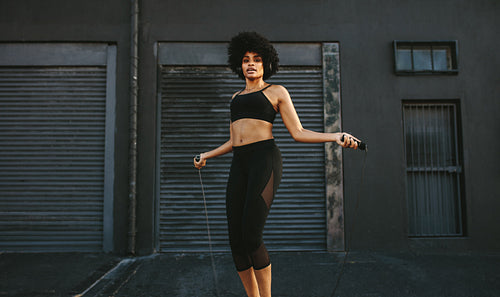 Fitness female doing skipping workout