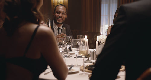 Friends having wine at dinner party