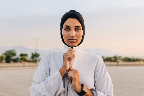 Portrait of a Muslim woman standing outdoors in sportswear