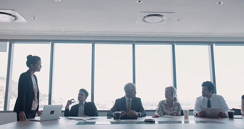 Businesswoman giving a presentation to her team