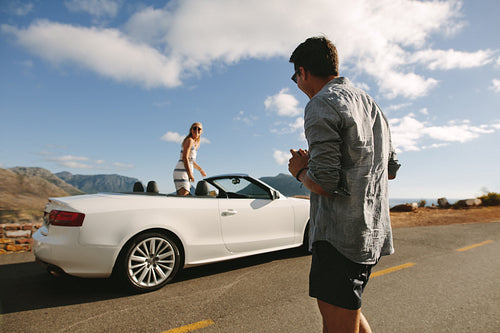 Couple having a photo shoot on their road trip
