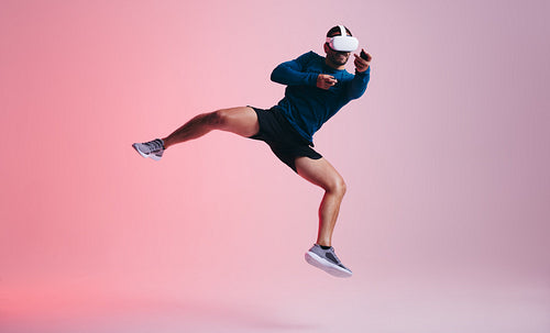 Man playing a virtual reality shooting game