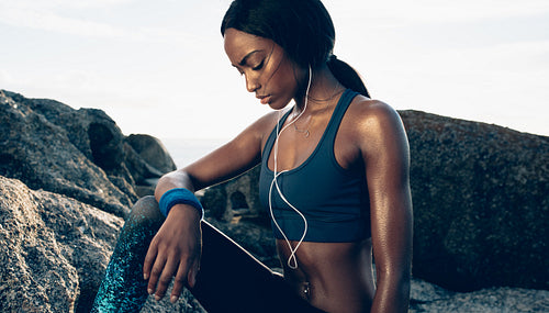 Woman taking break after exercising outdoors