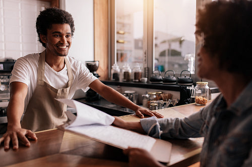 Barista taking an order from a customer