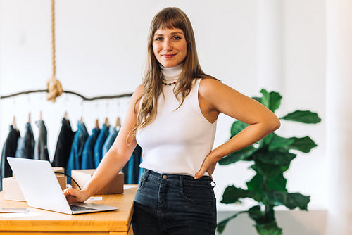Confident store owner looking at the camera in her shop