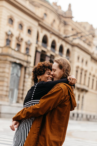 Affectionate embrace on a romantic city street walk