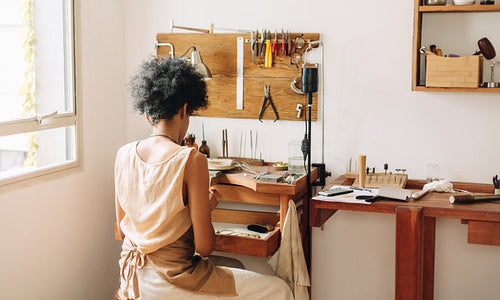 Artist at work making accessories in workshop