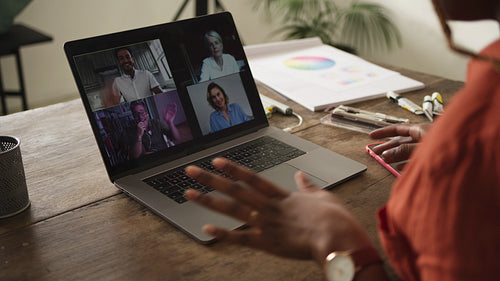 Creative businesswoman greeting her partners on a video call