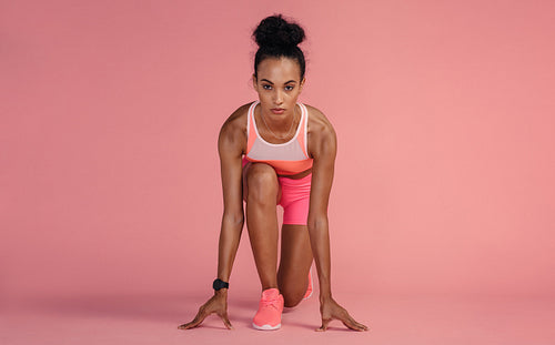 Sportswoman about to start a run