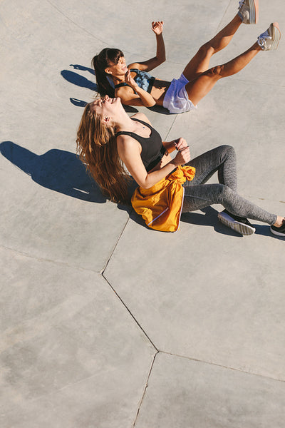 Women friends having fun at skate park