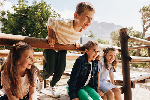 Group of happy children playing outdoors in a nature setting