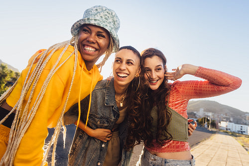 Group of female friends laughing together outdoors
