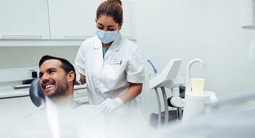 Male patient smiling in dentist's chair