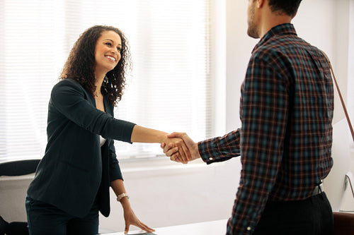 Businesswoman shaking hand with a business partner