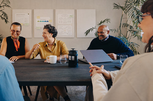 Diverse team holding a collaborative meeting in a modern office setting