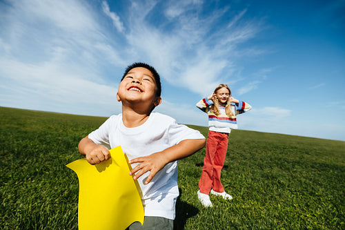 Kids enjoying summer fun in sunny open field