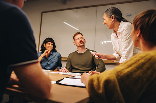 Entrepreneur having a meeting with staff in boardroom