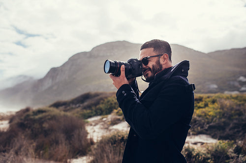 Photographer photographing in nature on winter day