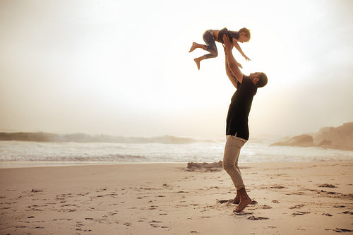 Father and son enjoying holidays at the sea shore