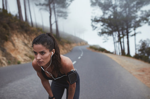 Female runner taking a break from workout