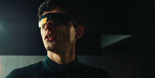 Runner wearing sport sunglasses in a close portrait for fitness and running eyewear advertising