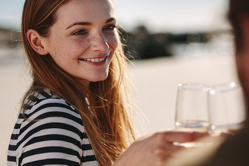 Beautiful woman toasting champagne with her boyfriend