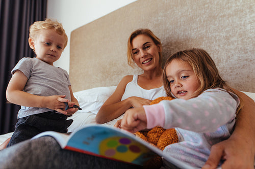Happy family reading a bedtime storybook