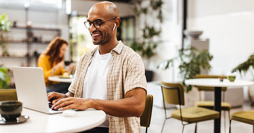Digital nomad working on the go at coffee shop