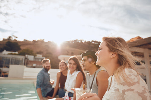 Group of friends enjoying poolside party