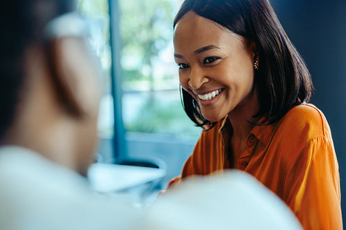 African businesswoman smiling during a professional meeting
