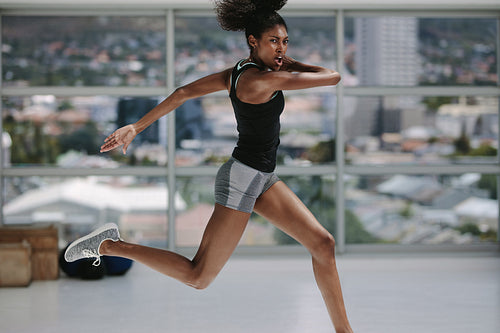 Sporty woman doing exercises at fitness studio