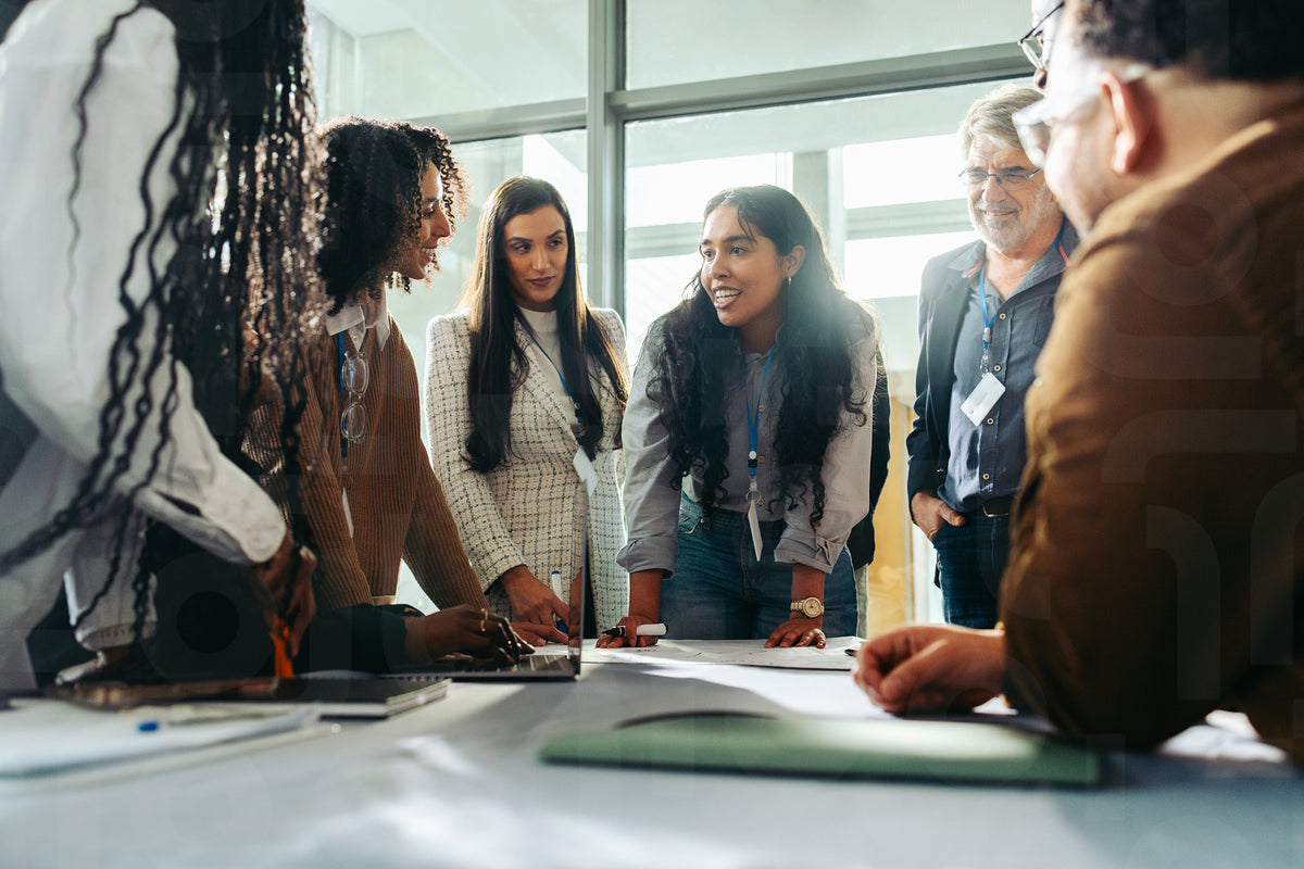 Diverse team brainstorming during a business meeting in a modern offic ...